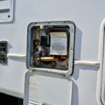 Carvan Hot Water System latch open in caravan
